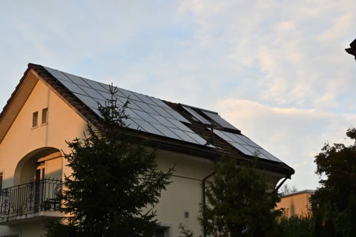 Solar panels or photovoltaic panels installed on the roof of a family house.